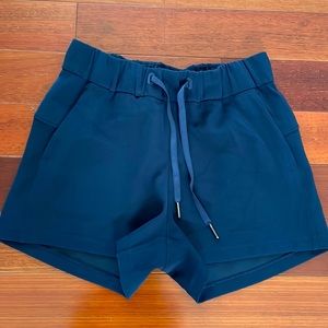 Lululemon navy blue shorts with two side pockets and drawstring. Size 2. NWOT